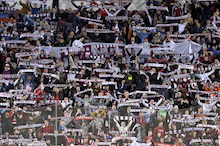 supporters singing at the stadium